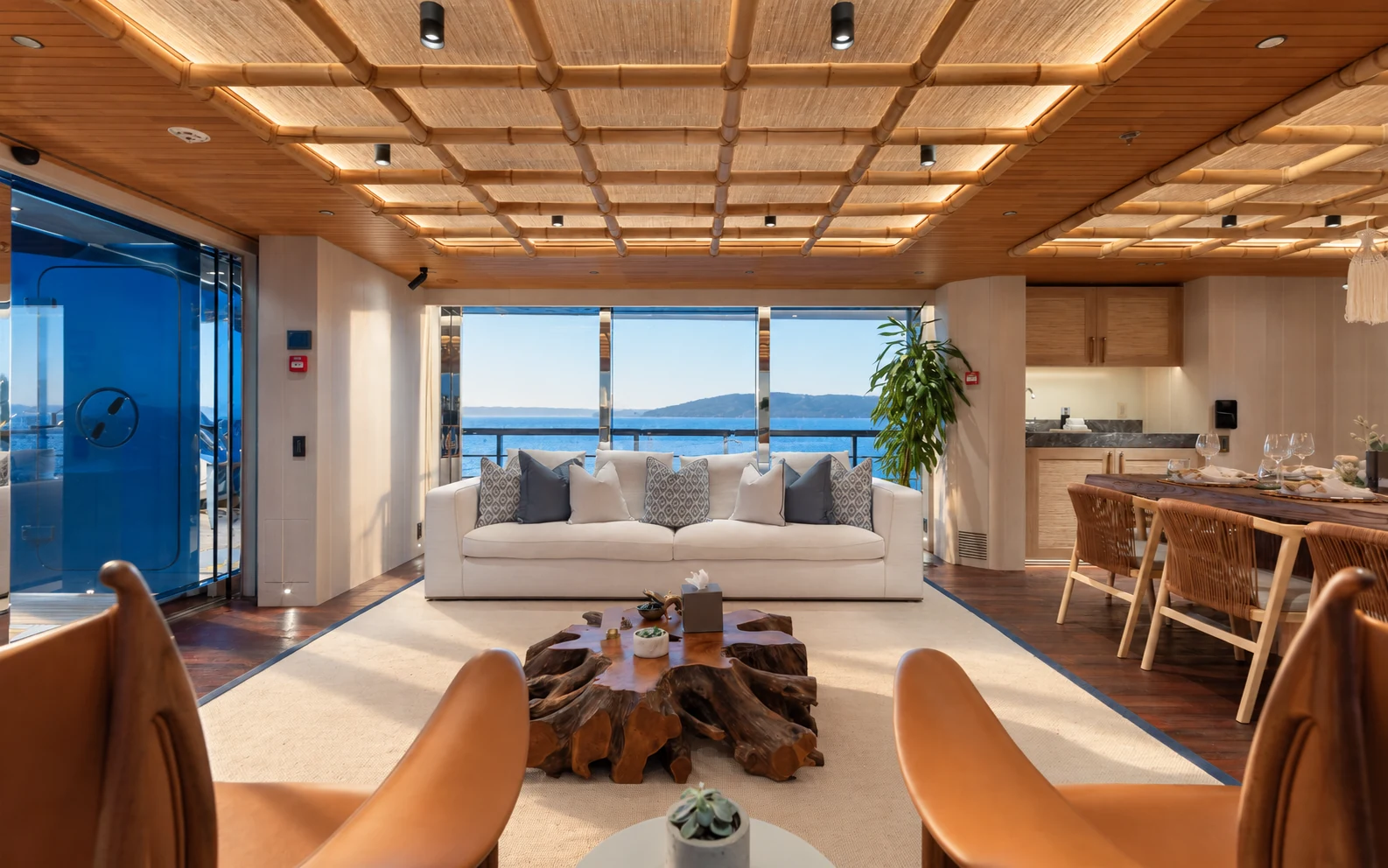 Main deck dining table under a bamboo ceiling